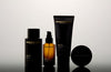 Sebastian Dark Oil Trio by Sebastian Professional featuring three bottles of dark oil hair treatment with sleek packaging.